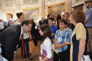 Ambassador Dan Shapiro greets a JPDS-NC student at the Congressional Gold Medal Ceremony.