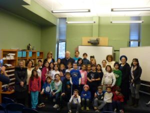 Ambassador Kurtzer poses with students in the Rabin Library.