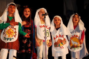 Jacob's sons sing together onstage.