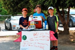 Students raise money for Nepal earthquake relief outside of school.