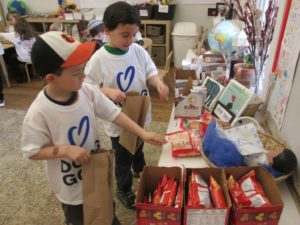 Young students help create snack bags for SOME (So Others Might Eat) during Yom Chesed.