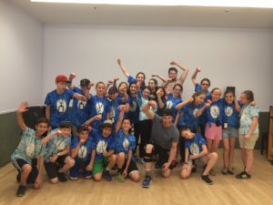 Students pose at the end of a dance workshop session.