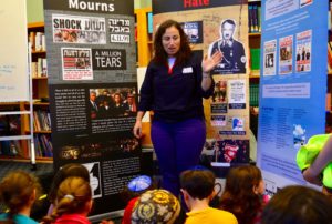 An Israeli educator from the Yitzhar Rabin Memorial Project speaks with students as part of the kick-off event of JPDS-NC's annual Yitzhak Rabin Memorial Curriculum.