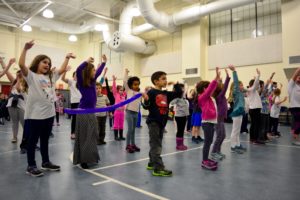 The Gottesman Auditorium is filled with children dancing at the Dance-a-Thon.