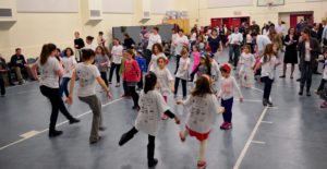 The Gottesman Auditorium is filled with children dancing at the Dance-a-Thon.