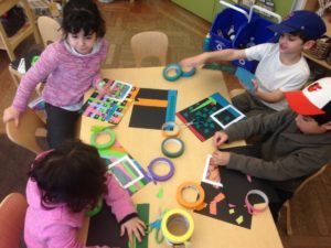 Kindergarten students work to replicate and magnify an area of their own homemade collages during the "Zoom In" challenge.