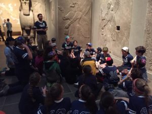 Students sit in the antiquities exhibit at the Metropolitan Museum of Art.