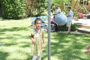 A student plays tetherball at the New Family Summer Brunch.