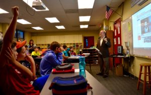 JPDS-NC parent Mr. Kelner speaks with sixth grade students.