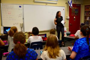 Leora Klapper speaks with sixth grade students.