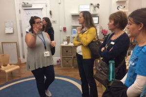 Kindergarten teacher Xani Pollakoff leads visitors on a tour of the South Campus.