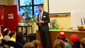 JPDS-NC parent and Acting Under Secretary for Terrorism and Financial Intelligence for the Department of Treasury Adam Szubin speaks with fourth graders about international diplomacy.