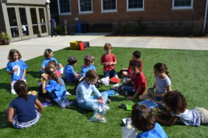 JPDS-NC students eat lunch together with their new friends from Horace Mann.