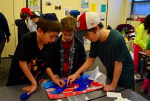 Students play games created by Sixth Graders based on the Odyssey.