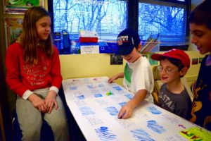 Students play games created by Sixth Graders based on the Odyssey.