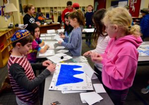 Students play games created by Sixth Graders based on the Odyssey.