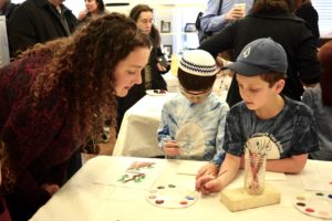 First graders share their learning this semester with their parents at the First Grade Bayit Patuach (Open House).