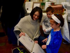 First graders share their learning this semester with their parents at the First Grade Bayit Patuach (Open House).