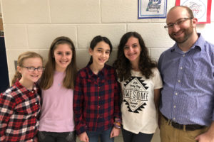 Gabri K, Reut S, Shoshana L, and Adi M pose with Science Specialist Joshua Ackerman.