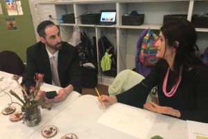 Pedagogista Laura Cohen speaks with a participant at the Community Day of Learning