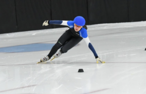 Ava Fradlin ('14) comes around a turn on a speed skating track.