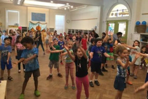 Kindergartners fill the Kikar with Israeli Dancing on Mitzvah Day.
